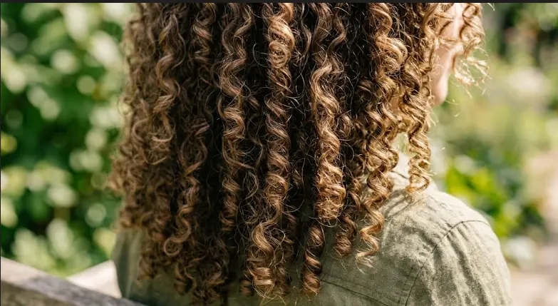 Close-up of well-defined curly hair texture with natural shine
