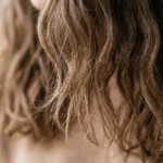 Close-up of dry damaged hair texture and split ends